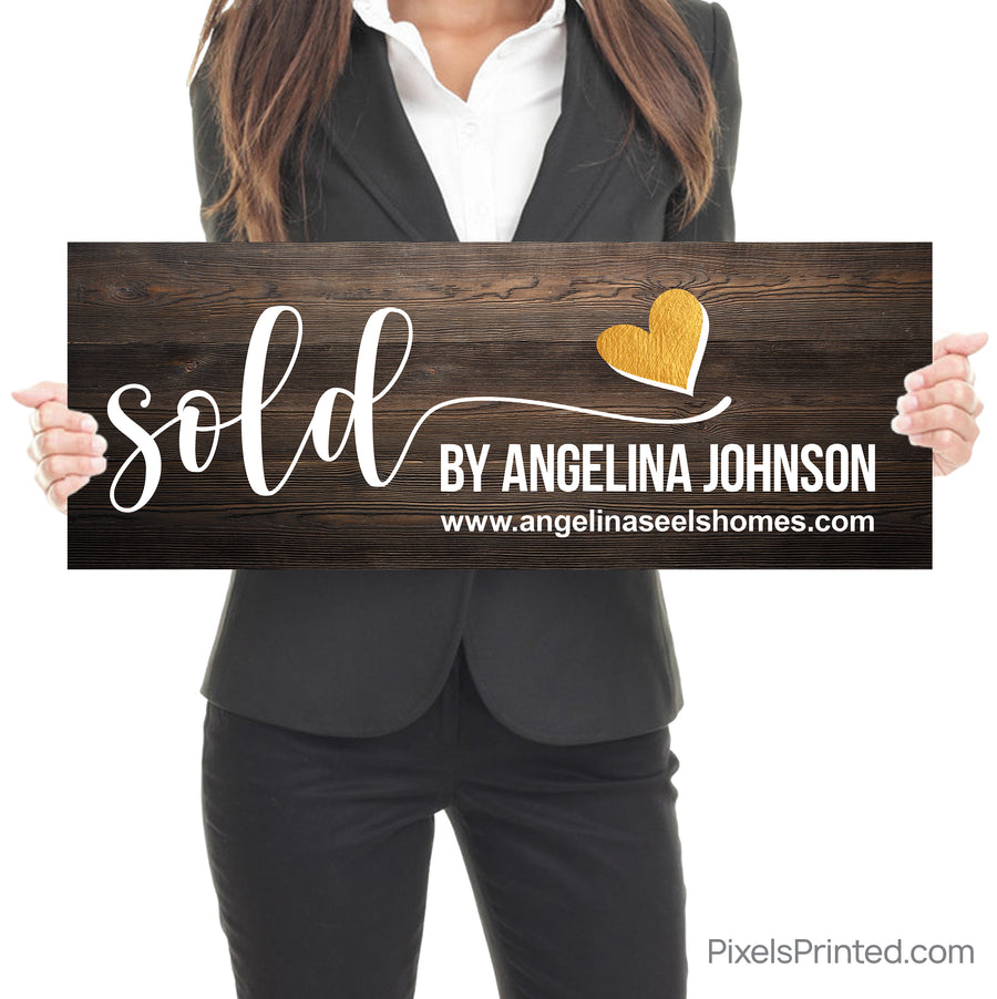 closing photo sign with homeowners sold by realtor with gold heart